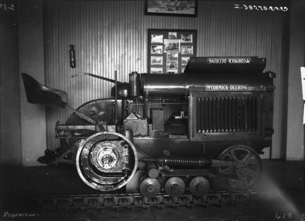 Interior view of a machine used to repair a McCormick-Deering tractor at a dealership.