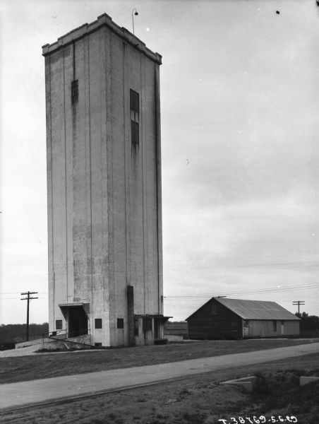 View of barnyard with silo.
