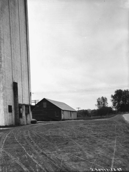 View of barnyard with silo.