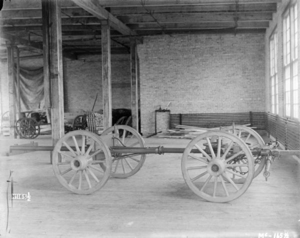 Wagon chassis set up indoors at McCormick Works.