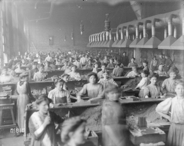 Women working in a finishing (?) parts room  at McCormick Works.