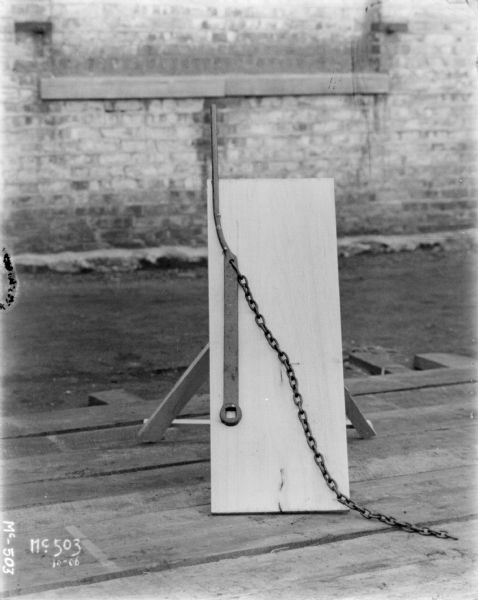 Wagon parts displayed against a board resting on a pallet at McCormick Works.