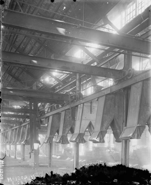 View of  beams, windows, and ceiling of factory at McCormick Works.
