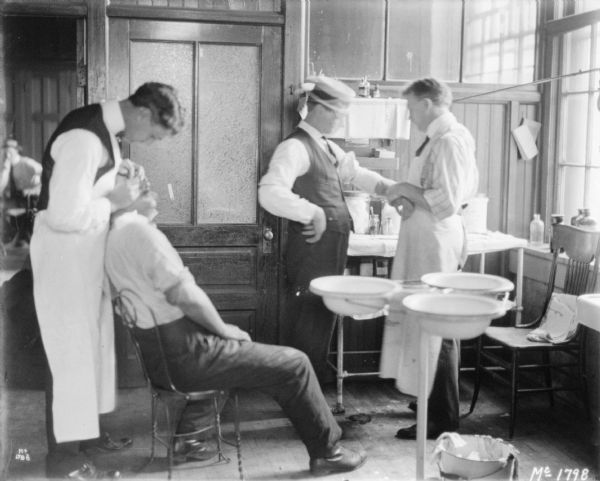 Employees being treated in an infirmary.