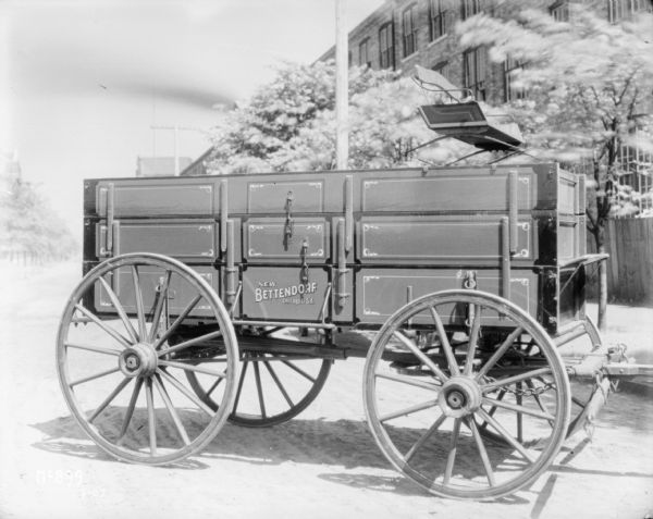 Right side view of a New Bettendorf wagon outside the factory at IHC McCormick Works.
