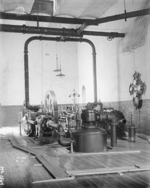 Interior view of manufacturing area, with a furnace, at McCormick Works.