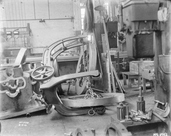 Franklin Portable Crane indoors at McCormick Works. The crane is disassembled and is laying on its die.
