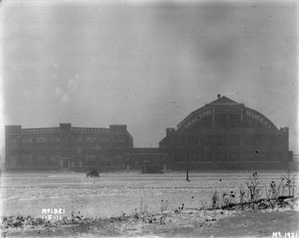 View across streeet towards the International Harvester Co. factory building on the left, and the Tractor Works building on the right.
