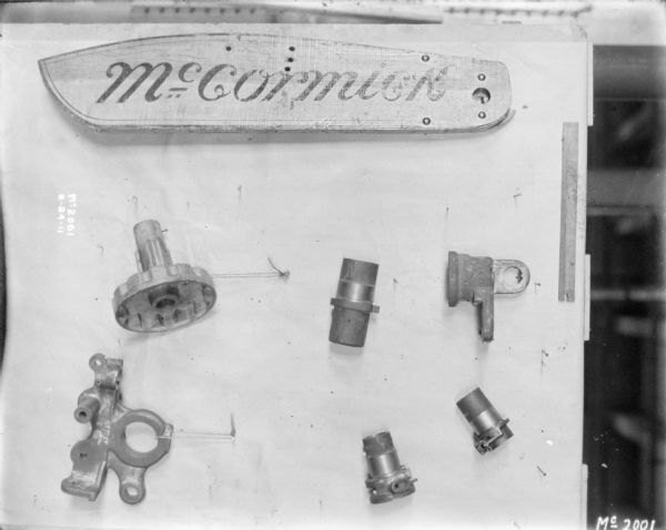 Parts displayed on a board. There is a painted board part that reads: "McCormick."