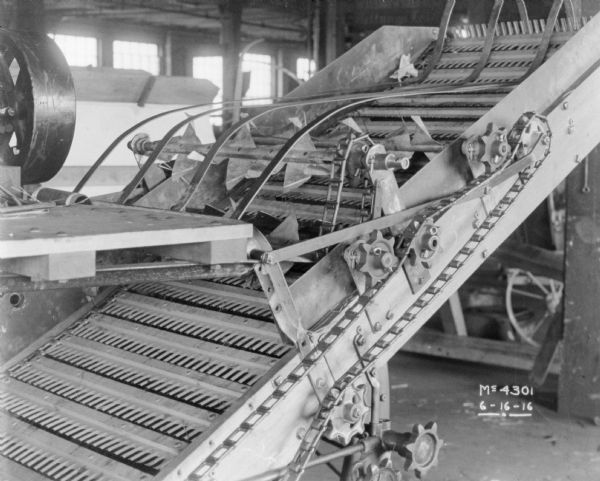 Close-up of a Thresher indoors on factory floor.