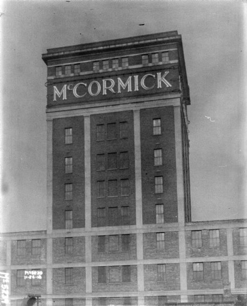 View towards a factory building with a "McCormick" sign near the roof.