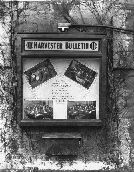 Harvesters Bulletin on brick wall. The sign reads: "Do you attend any of these Evening Classes at the High School? If not — why not? A splendid opportunity to improve your education FREE." Includes four photographs of people sitting in classrooms, with one identified as a Commercial Class, and another as Mechanical Drawing.