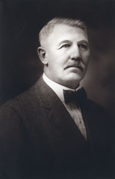 Quarter-length studio portrait of E.E. Manuel, Superintendent of the Winnebago County Asylum.