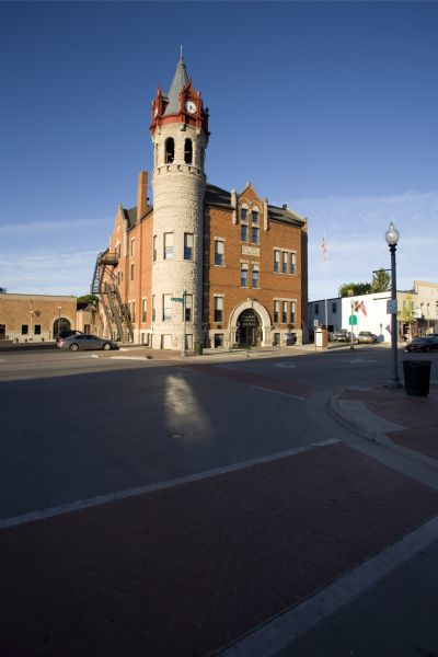 View of Stoughton city hall building, clock tower and second-story opera house from across street.