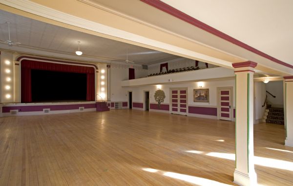 View of stage and main floor of Independence Opera House from rear.