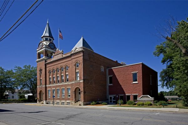 View of Independence Opera House, city hall, clock tower and public library building from across the street.