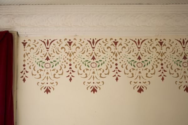 Close-up of replicated stencil work and molding in Independence Opera House auditorium.