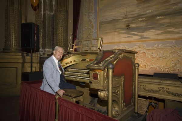 Local historian and Al. Ringling Theatre docent, Robert C. Dewel, seated at the Al. Ringling Theatre's "Mighty Barton" organ.