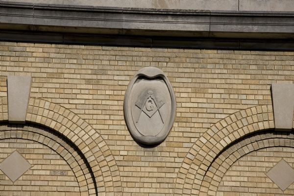 Carved stone medallion on exterior of the Temple Theatre featuring the Blue Lodge Masons' symbol.