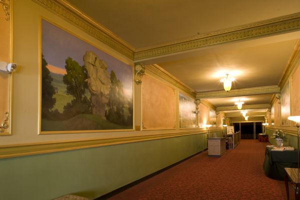 Temple Theatre Lobby including murals painted by Ken DeWaard depicting scenes of Vernon county.