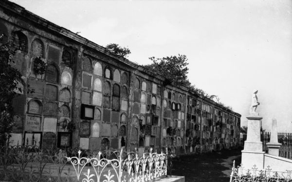 A cemetery with a wall of vaults.