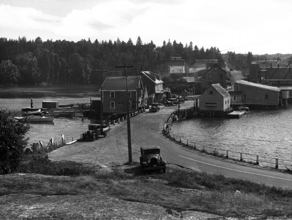 Elevated view toward the main street of a small fishing village.