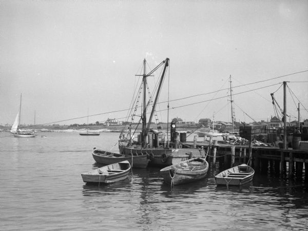 A view of a wharf with fishing boats.