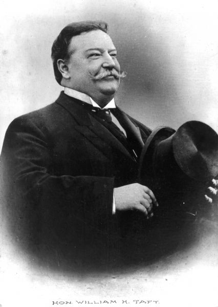 Vignetted portrait of William H. Taft (9/15/1857 – 3/8/1930), the 27th President of the United States (3/4/1909 – 3/4/1913) and later the 10th Chief Justice of the United States (6/30/1921 – 2/3/1930). Caption at bottom reads: "Hon. William H. Taft."