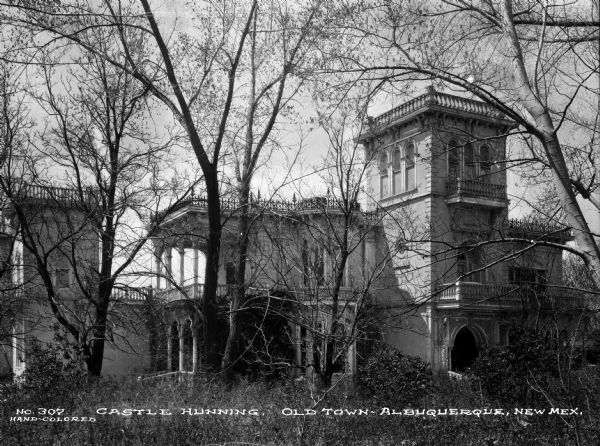 Castle Huning, an elaborate home built in 1883, is located in the Old Town sector of Albuquerque, New Mexico. Caption reads: "Castle Hunning. Old Town – Albuquerque, New Mex."