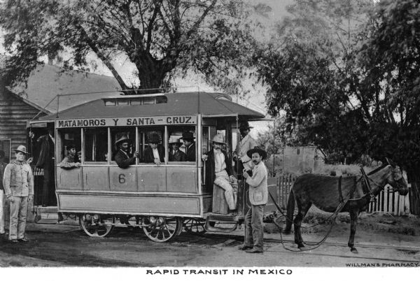 A mule-drawn bus, "Matamoros y Santa Cruz," acting as rapid transit in Mexico. Caption reads: "Rapid Transit in Mexico."
