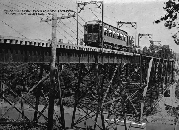 Harmony Route was a limited stop direct to New Castle departing Liberty and Market. The first trolley ran in 1908. Caption reads: "Along the Harmony Route, Near New Castle, PA."