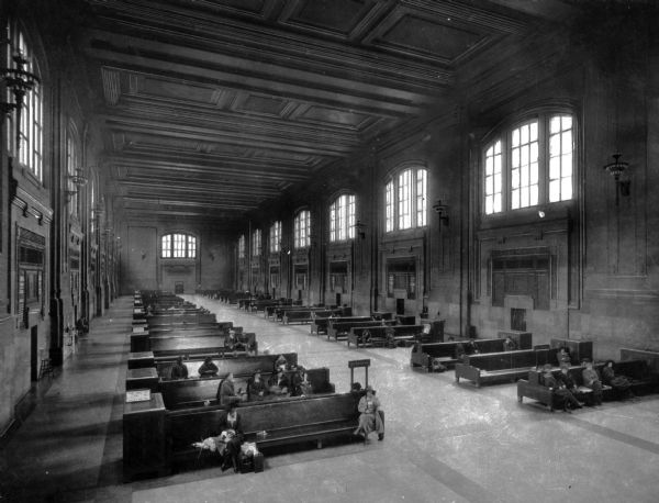 Slightly elevated view of people gathered in the main waiting room of the Union Railroad Station, capable of holding up to 10,000 people.