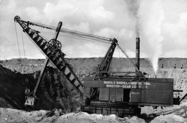 A Marion Shovel, Model 300, produced by the Winston-Dear Company, likely in Marion, Ohio, is put to use at the Hull Rust Mahoning Mine, in Hibbing, Minnesota, the world's largest open pit iron ore mine.