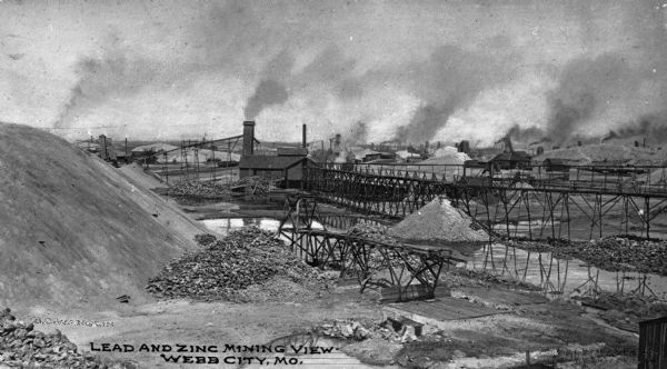 Webb City was known as the world's largest and most productive lead and zinc mining field in the late 1800s and early 1900s and was part of the "Tri-State Mining District." Caption reads: "Lead and Zinc Mining View, Webb City, MO."