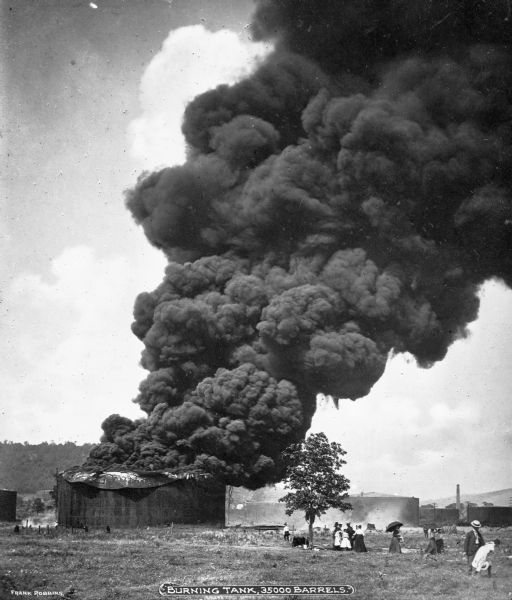 An oil tank burns in an oil field, probably in Titusville, Pennsylvania, where the first oil well was constructed in 1859.  In total, 35,000 barrels burned. Caption reads: "Burning Tank, 35000 Barrels."