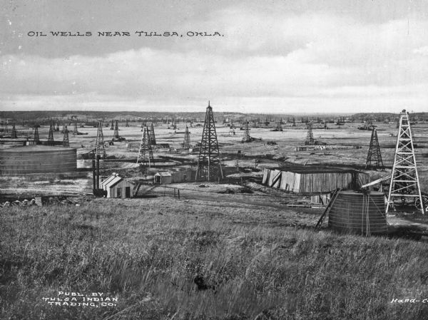 Oil wells in Tulsa, a city that had earned the title "Oil Capital of the World" and whose population grew to 72,000 by 1920. Caption reads: "Oil Wells near Tulsa, Okla."