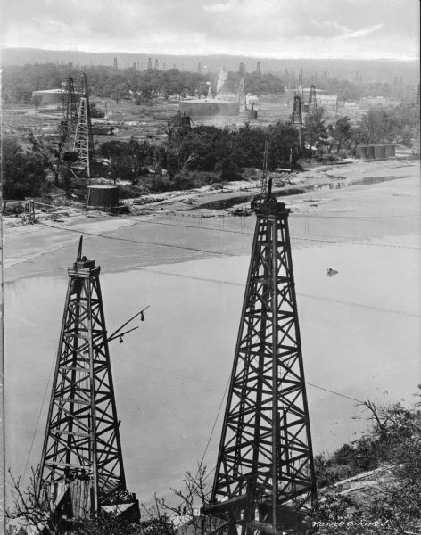 A view of oil rigs on  the Cimarron River, 100 miles from Tulsa, a city that had earned the title "Oil Capital of the World" and whose population grew to 72,000 by 1920.