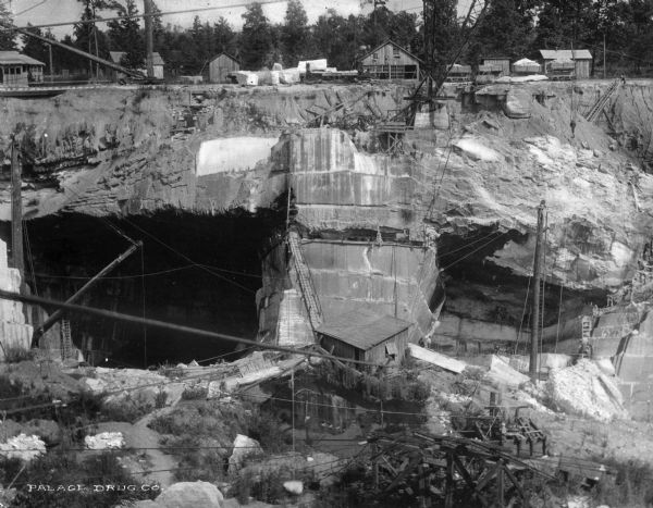 A view of a marble quarry in Sylacauga, "The Marble City," which is constructed on a solid deposit of the hardest, whitest marble in the world. The bed is approximately 32 miles long by one and one half miles wide and 400 feet deep.