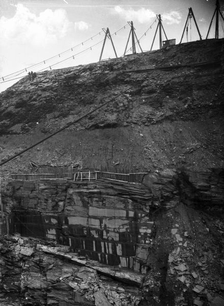 Cables run across Flitcher's Slate Quarry, located in Bangor, a region which became a major world center for slate. The slate industry was begun in Bangor by Robert M. Jones in 1848.