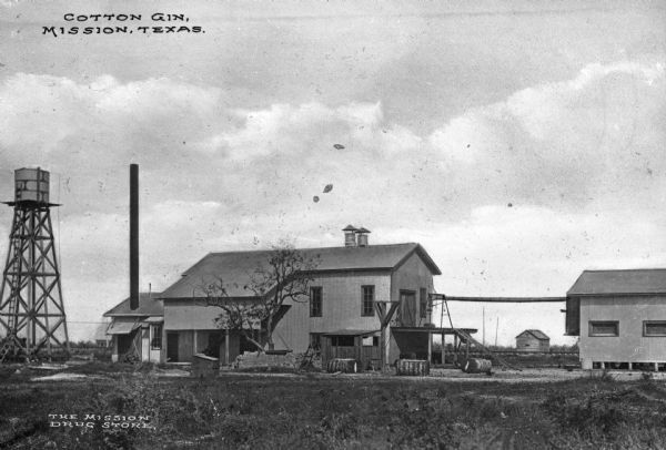 A warehouse and cotton gin. Caption reads: "Cotton Gin, Mission, Texas."