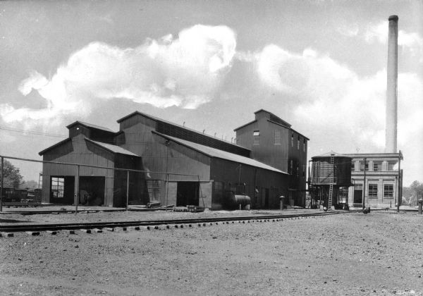 Exterior view of a power house and lumber treating plant. Partly due to the growing lumber industry, East Radford's population grew from 300 in 1880 to 3,000 in 1890.