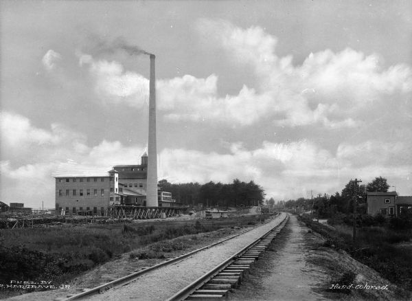 Exterior of the Chesapeake Pulp and Paper Mill, founded in 1918. It began operations as a kraft pulp and paper mill, and has expanded to supplying specialty paperboard packaging products in Europe.  Photograph published by F. Hargrave, Jr.