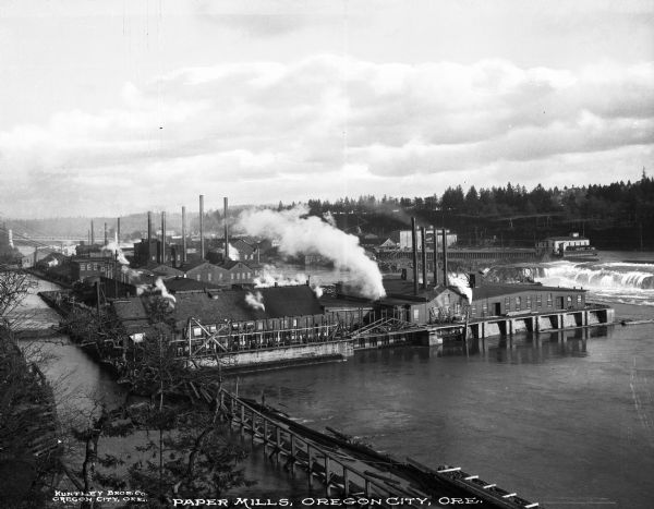 Exterior elevated view of the Hawley Pulp and Paper Mill. Caption reads: "Paper Mills, Oregon City, ORE.