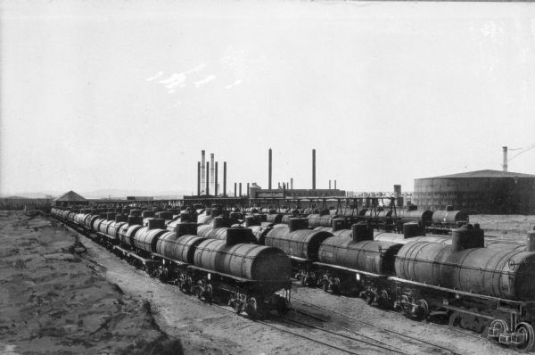 Railroad Tank Cars in the process of being filled on the Wyoming Central Railway.
