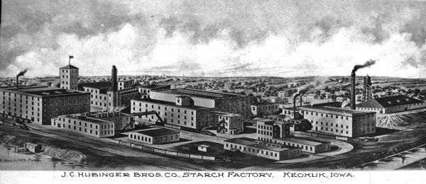 Elevated panoramic view of the J.C. Hubinger Brothers Company Starch Factory. After the opening of their first successful elastic starch factory in New Haven, Connecticut by brothers John Carl, Nicholas, and Joseph, John Carl opened a second starch factory in 1887 in Keokuk, Iowa. Caption reads: "J.C. Hubinger Bros. Co., Starch Factory, Keokuk, Iowa."