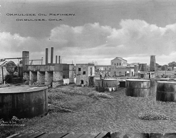 View of the Okmulgee Oil Refinery. Okmulgee county was known for its oil refineries, producing 45,000 barrels a day from October to December 1919. Caption reads: "Okmulgee Oil refinery. Okmulgee, OKLA."