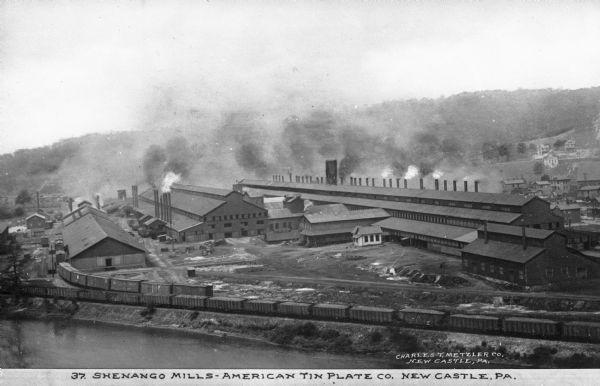 In 1897, Shenango Mill was constructed and became the largest mill of its kind in the world, owned by the American Tin Plate Company, which was founded on December 14, 1898. Caption reads: "Shenango Mills - American Tin Plate Co. New Castle, PA."