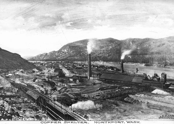 Northport Mining and Smelting Company was incorporated in June 1898, becoming Northport Smelting and Refining Company in July 1901.  The plant complex is shown in a mountain setting.