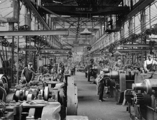 Men working in the machine shops of the National Manufacturing Company, founded in 1901.