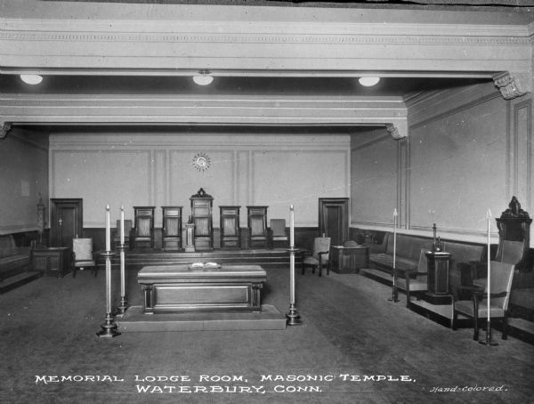 A view of an altar and seating in the Memorial Lodge room of the Masonic Temple. Caption reads: Memorial Lodge Room, Masonic Temple, Waterbury, Conn."